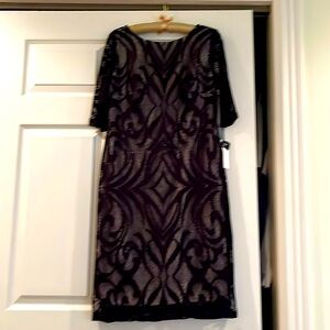NWT Cocktail Dress. Black lace design with nude attached slip lining. Size 10